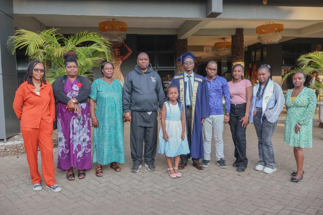 Three generations of family standing together with the graduate outside the ceremony venue